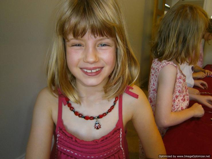 Beautiful hand made ladybird necklace worn by an 8 year old girl